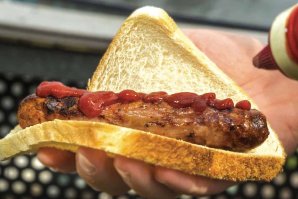 Tomato sauce and sausage on bread